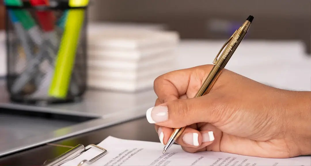 person writing using pen