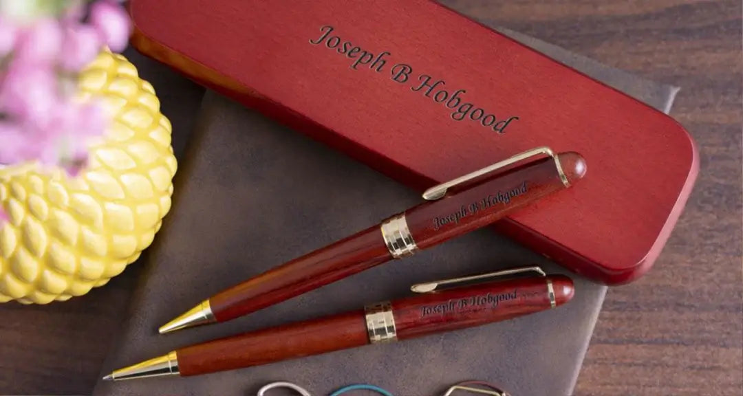 Luxury Pen rests on blank paper next to a cup of coffee