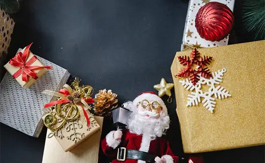 Colorful gift boxes and Secret Santa Claus toy