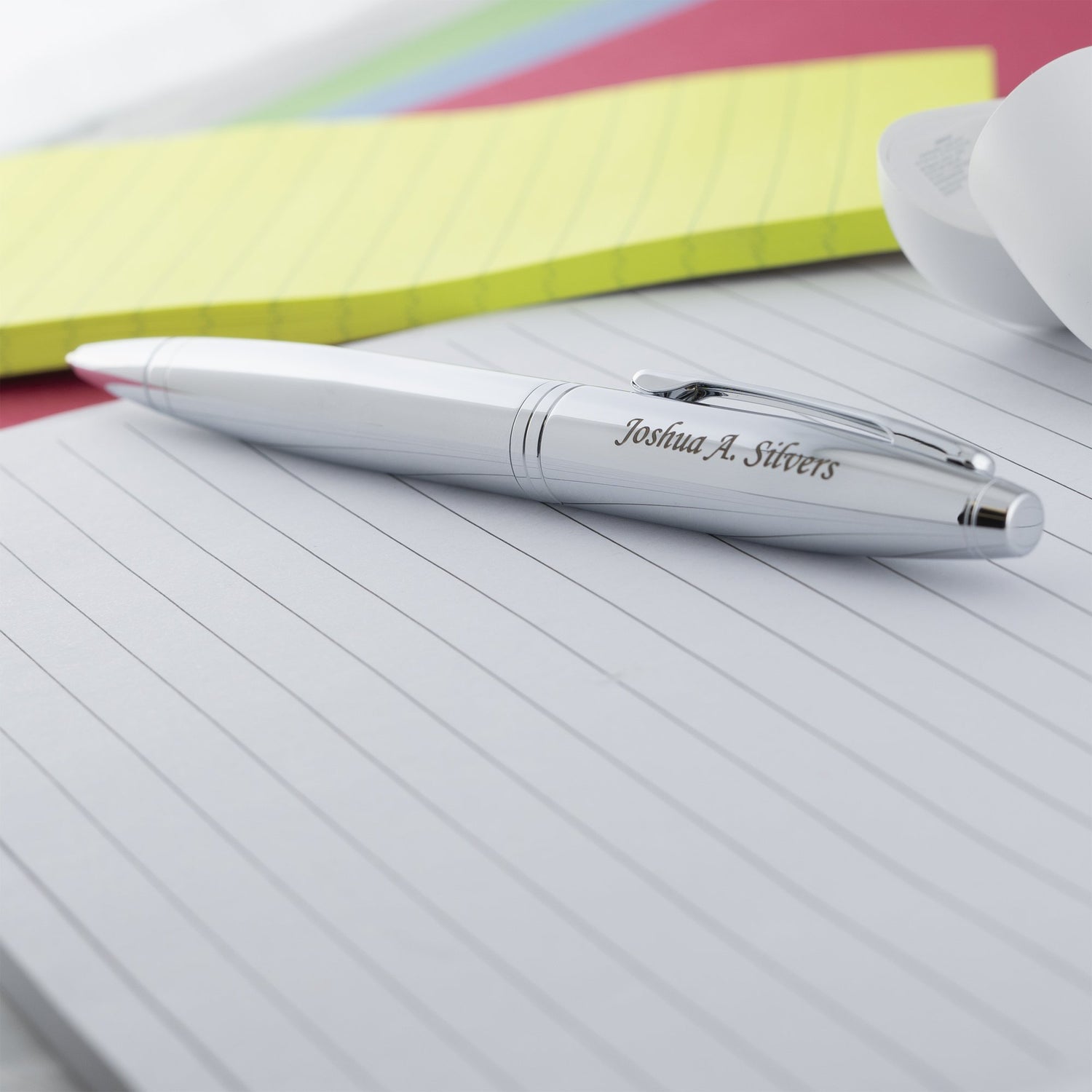 Engraved Calais Chrome Ballpoint sitting on a notepad