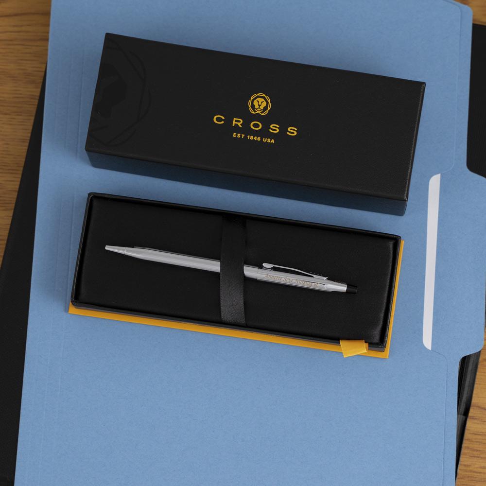 Engraved Classic Century Chrome Ballpoint sitting in box on top of folder