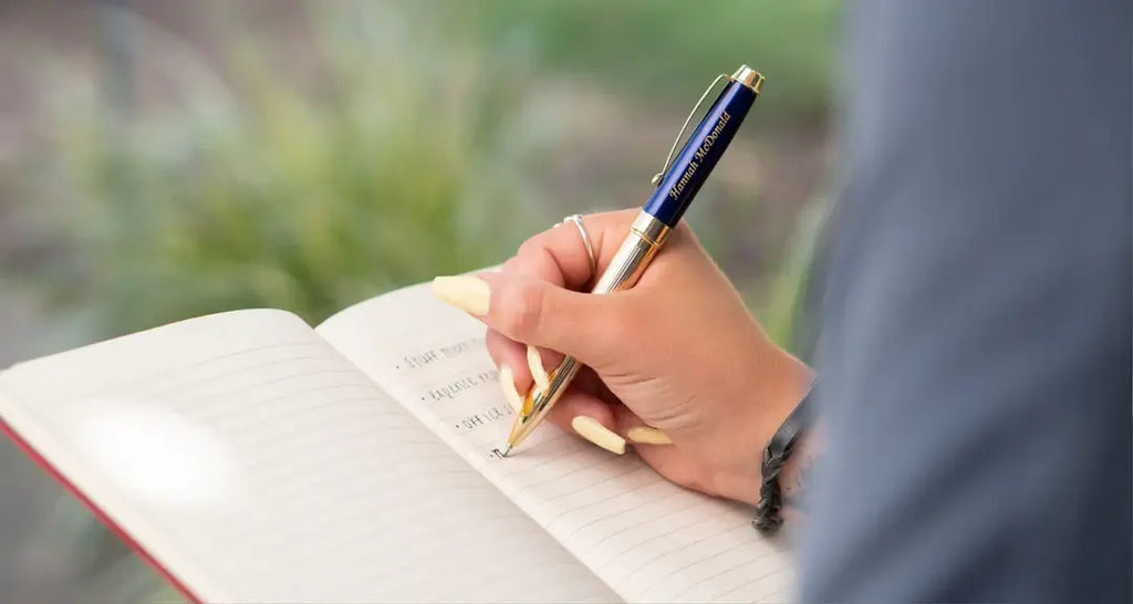 Premium Photo  Sketchbook with pencils and felttip pens on a blue table