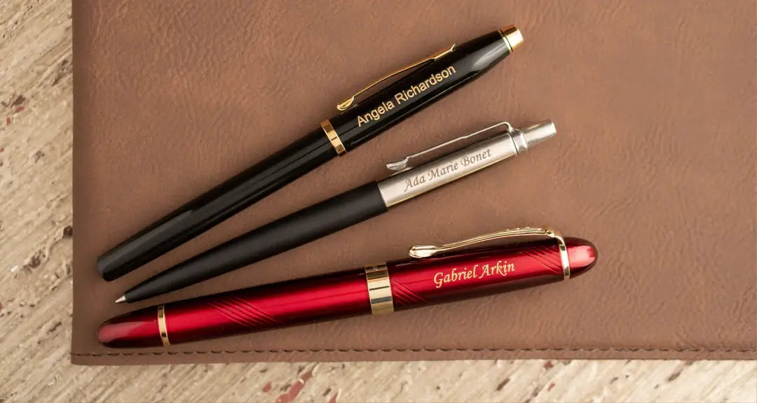 three pens with different engraving fonts