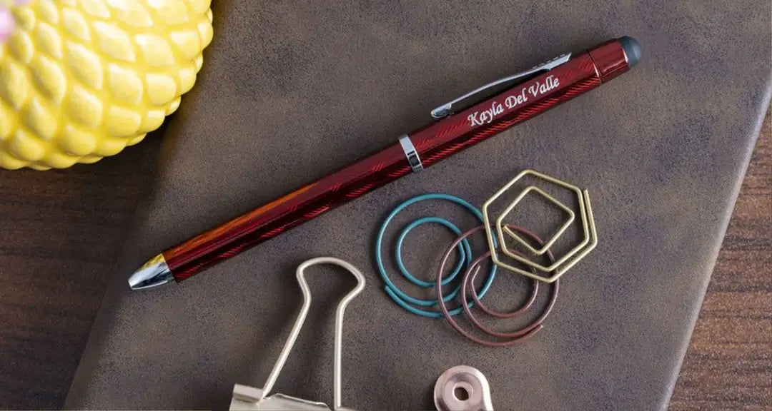 Teacher holds engraved pen Braxton rollerball for grading papers