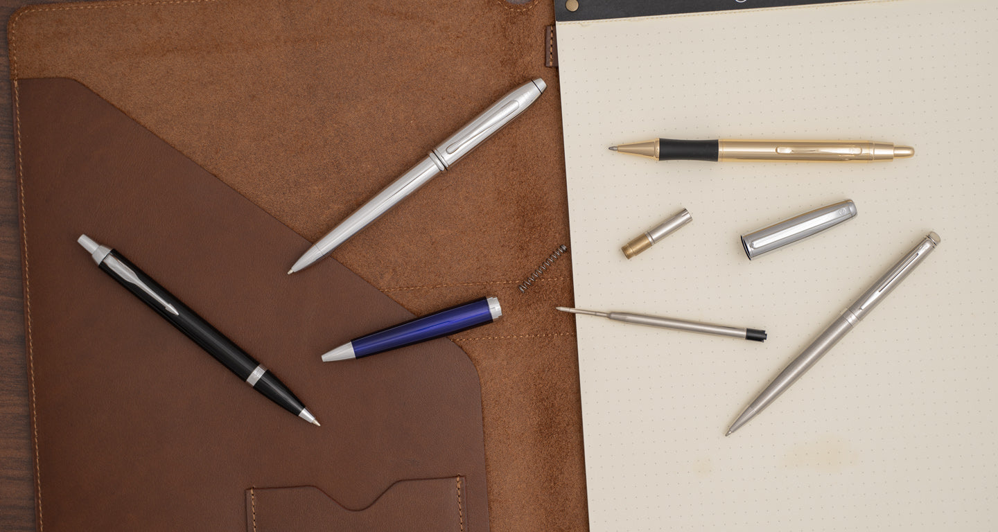 Ballpoint Pens layed out, the Parker IM, Cross Townsends, Gold Monroe, Waterman Hemisphere, disassembled Abingdon