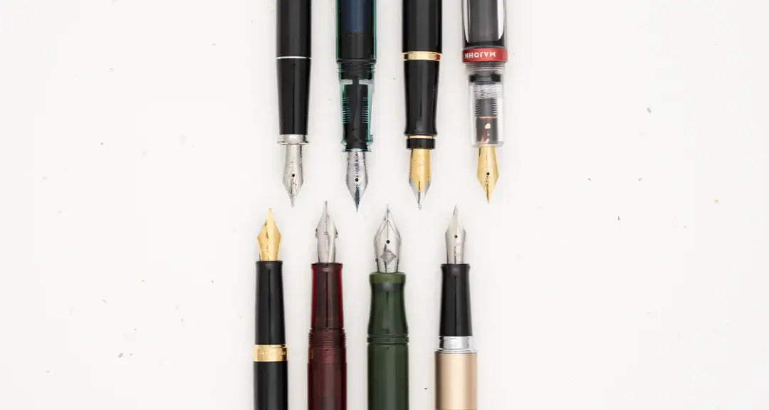 fountain pens left to right: waterman hemisphere, cross century II, monteverde, twsbi eco twist, franklin-christoph marietta, waterman expert, pilot metropolitan, majohn 