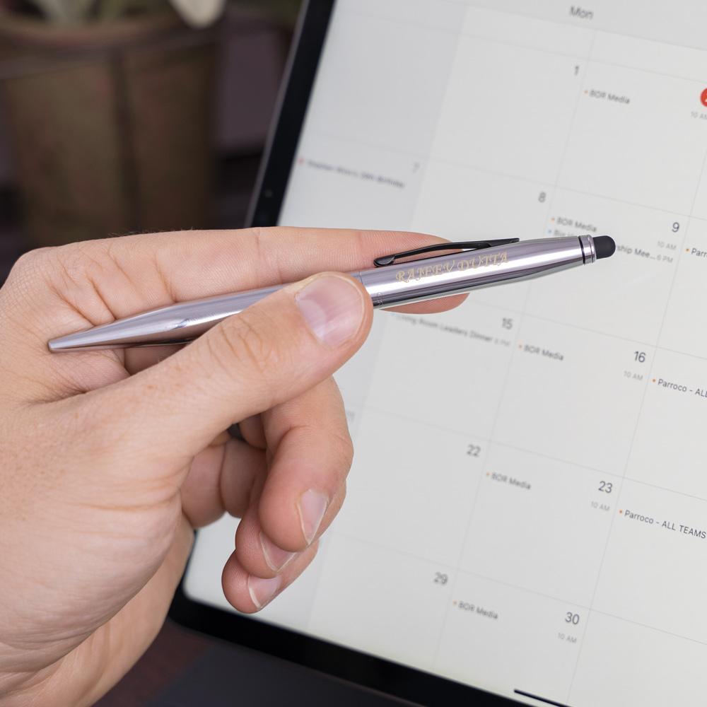 Man using engraved Tech2 Chrome Ballpoint for a stylus with tablet