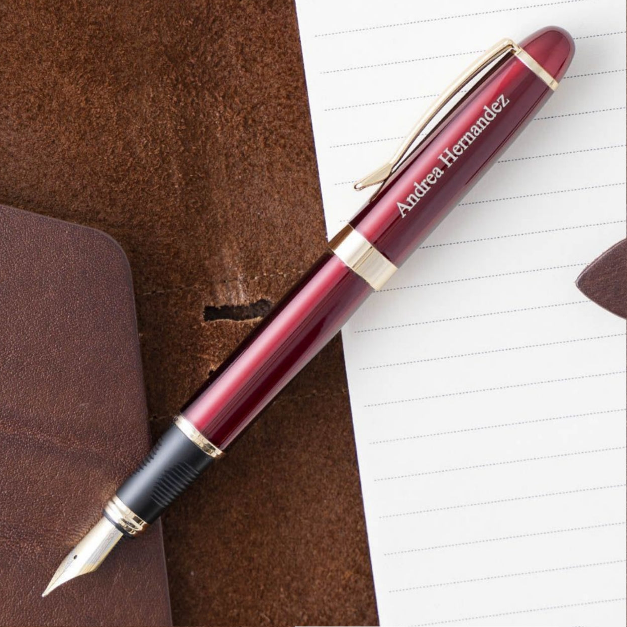 Engraved Alexandria Red Fountain Pen on top of open journal