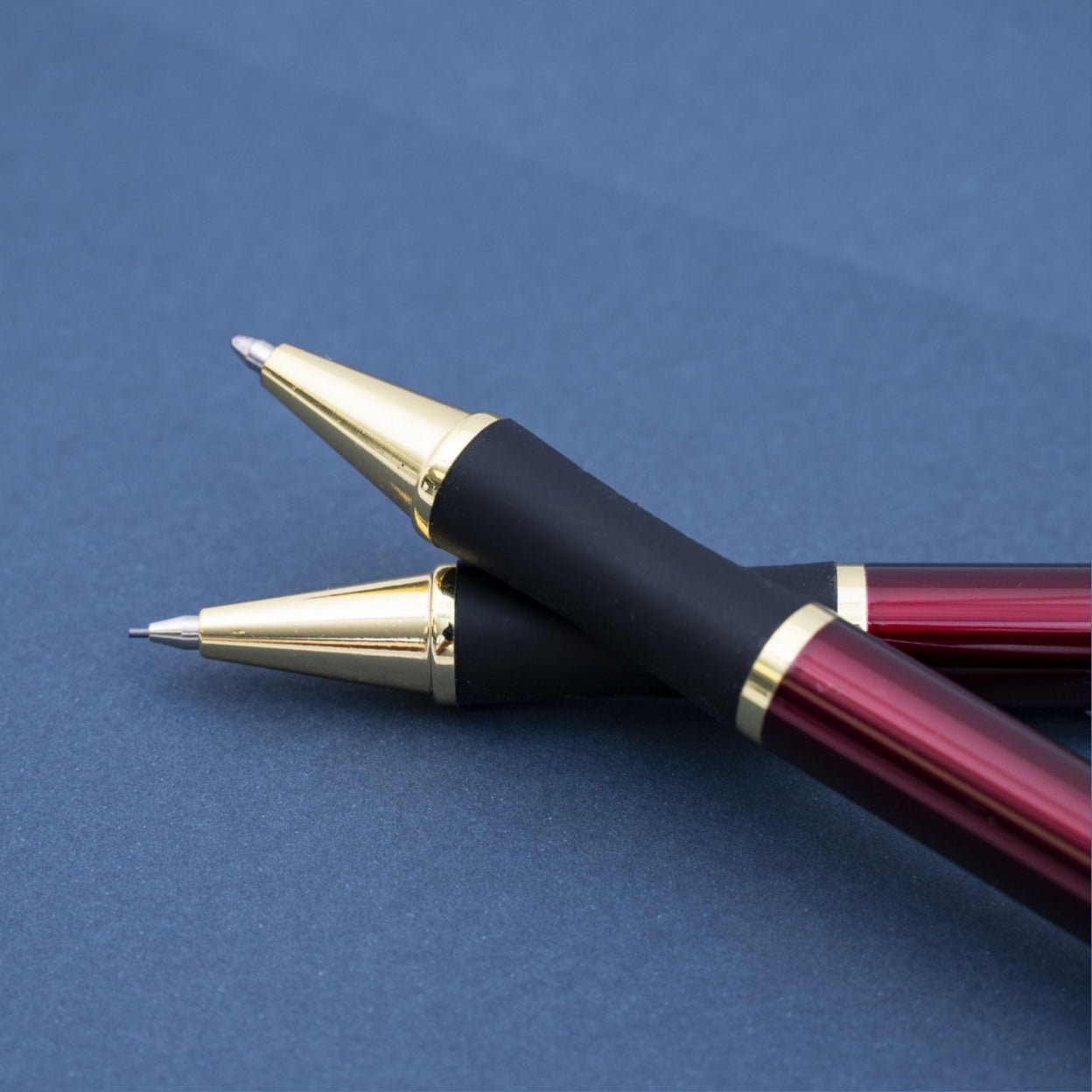 Monroe Red Pen and Pencil Set staked on each other for display
