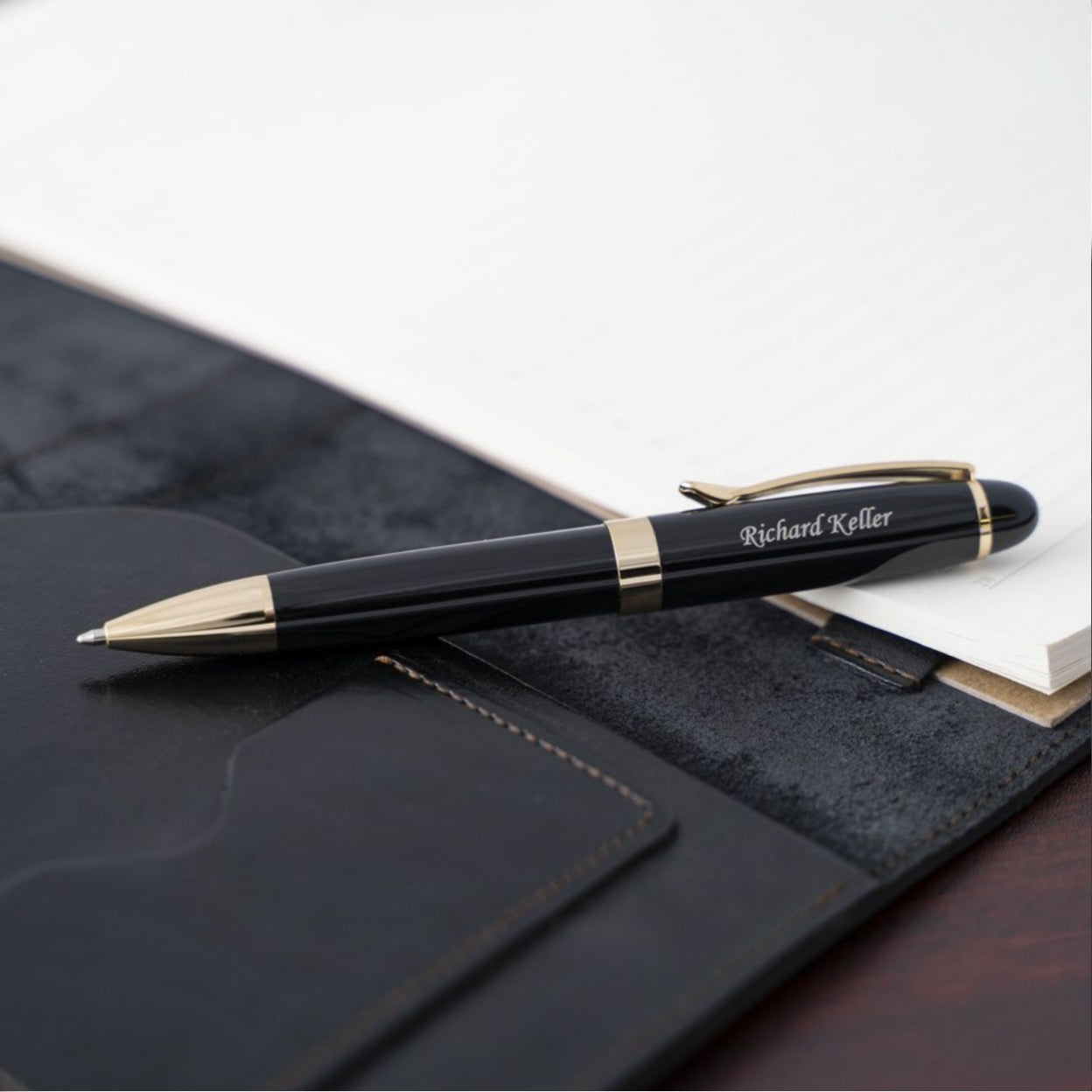 Engraved Alexandria Black Ballpoint placed on top of journal
