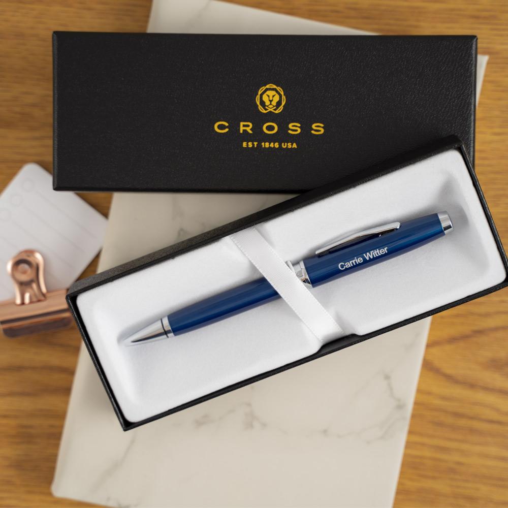 Engraved Coventry Blue Ballpoint in box on top of journal