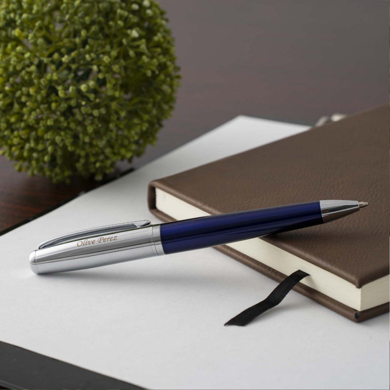 Engraved Abingdon Blue Ballpoint displayed on a journal 