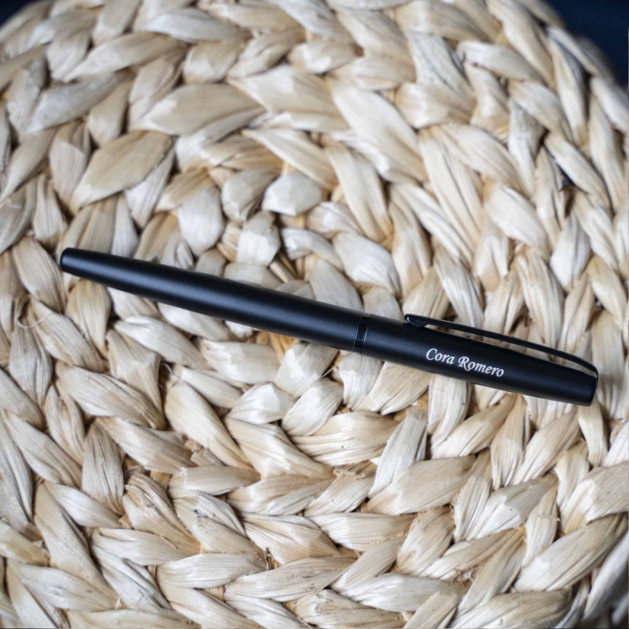 Engraved Richmond Matte Black Rollerball placed on basket for display