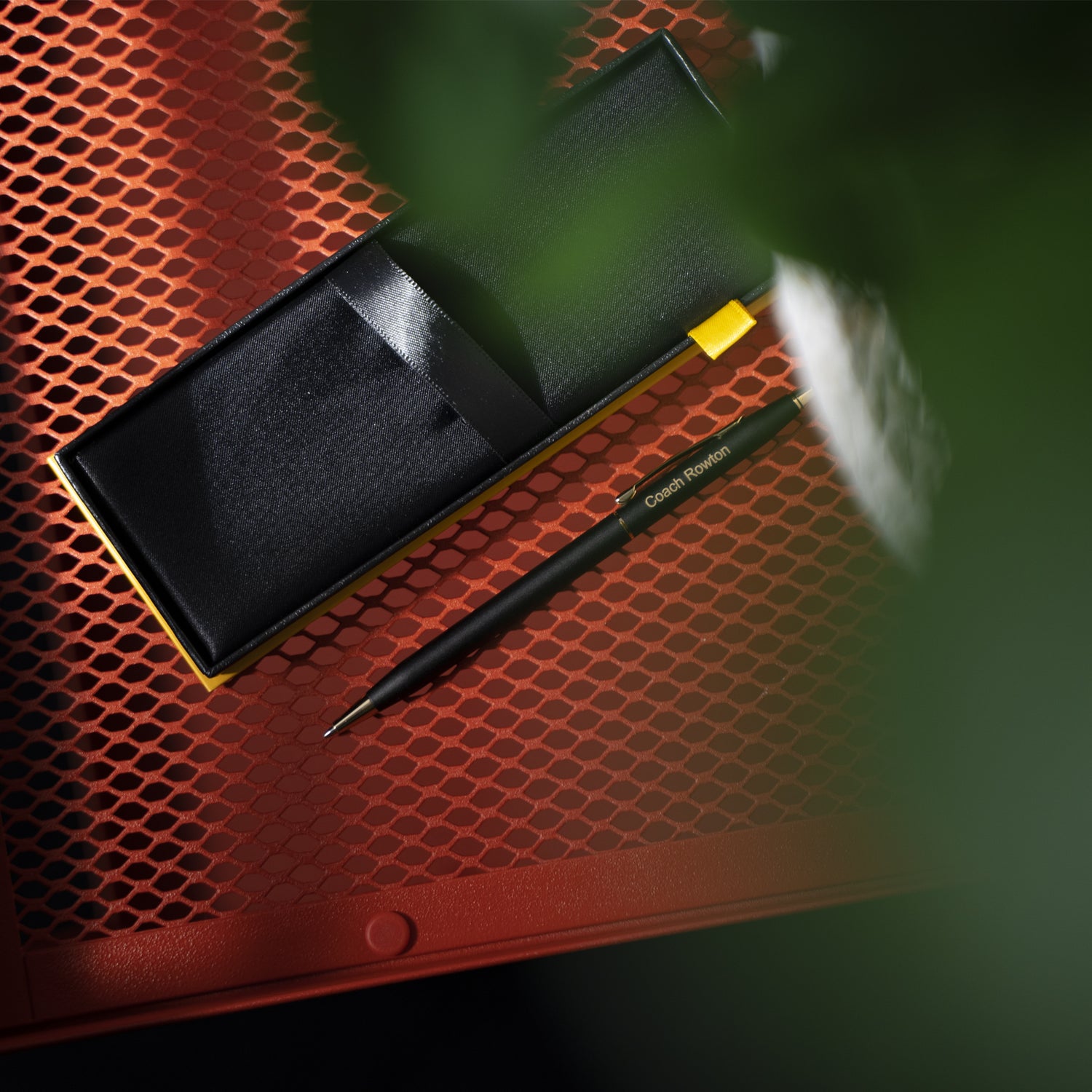 Engraved Classic Century Black Ballpoint sitting outside of box on table