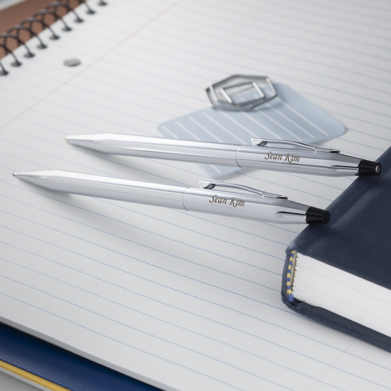Engraved Classic Century Chrome Ballpoint and Pencil Set placed on notebook