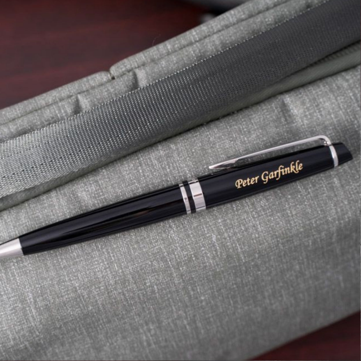 Engraved Expert Black Chrome Trim Ballpoint displayed on bag