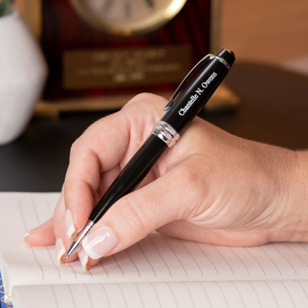 Woman using an Engraved Bailey Black Ballpoint to take notes 